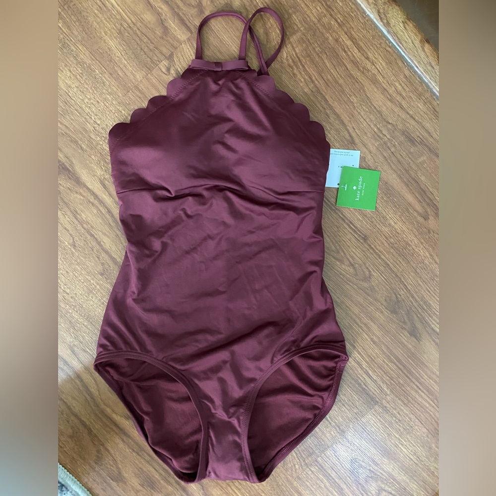 NWT Kate Spade Swimsuit with bow detail and scalloped edges.